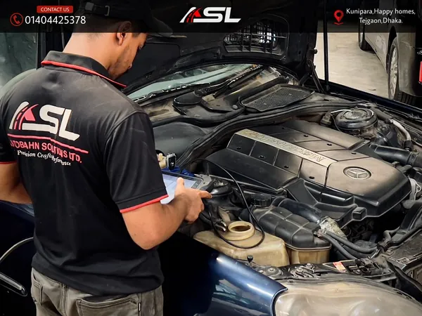 Technician running engine diagnostics on a Mercedes-Benz at Autobahn Solutions, Dhaka