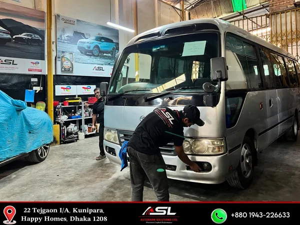 Toyota Coaster microbus being detailed at Autobahn Solutions, Dhaka