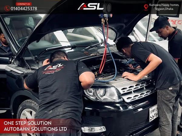 Team performing engine service on a Range Rover at Autobahn Solutions, Dhaka
