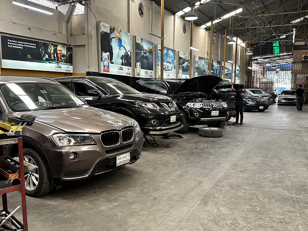 BMW SUV in the service bay at the Autobahn Solutions workshop in Dhaka