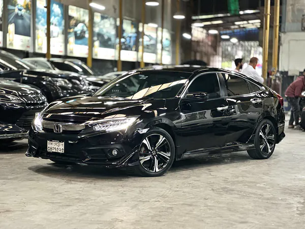 Honda Civic inside the Autobahn Solutions workshop in Dhaka