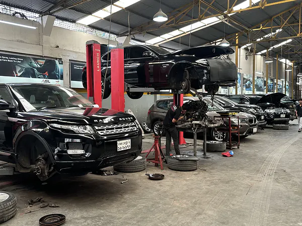 Land Rover with its wheels removed during brake and suspension work at Autobahn Solutions, Dhaka
