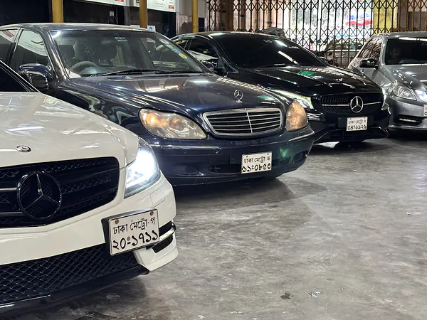 Mercedes-Benz models parked in the service bay at Autobahn Solutions, Dhaka