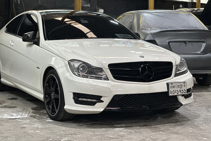 White Mercedes-Benz C-Class coupe in for service at the Autobahn Solutions workshop