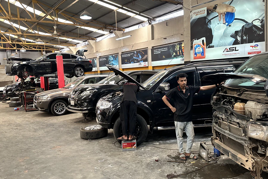 Vehicles undergoing inspection and diagnostics in the Autobahn Solutions workshop